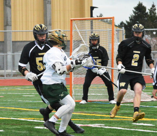Boys lacrosse team battling on league circuit