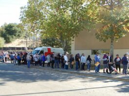Residents line up for fire relief