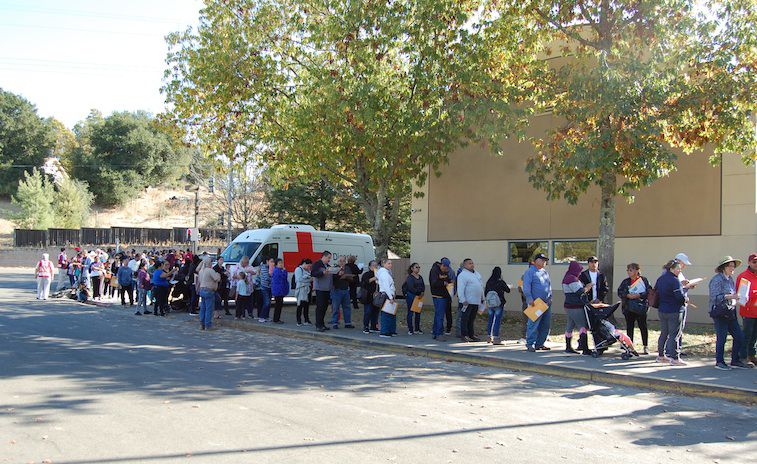 Residents line up for fire relief
