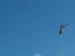 PG&E flying along the coast as part of aerial tree pruning