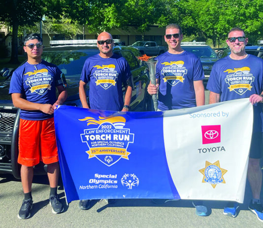 Members of the Healdsburg Police Department who participated in the June 2022 Law Enforcement Torch Run for Special Olympics. From left, Angel Rodriguez, Lt. Luis Rodriguez, Chief Matt Jenkins with torch, and Officer Nick Doherty.
