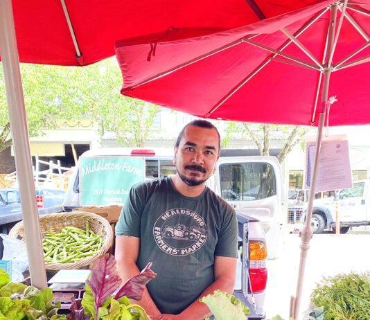 Sam works the Middleton Farm produce booth at a recent Tuesday Farmers’ Market. He says Middleton Farm has attended the Healdsburg Farmers’ Market since 1989.