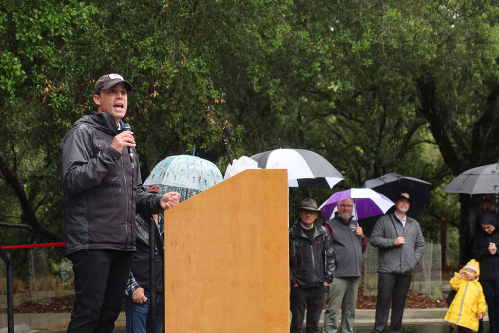 Mike McGuire giving speech in the rain