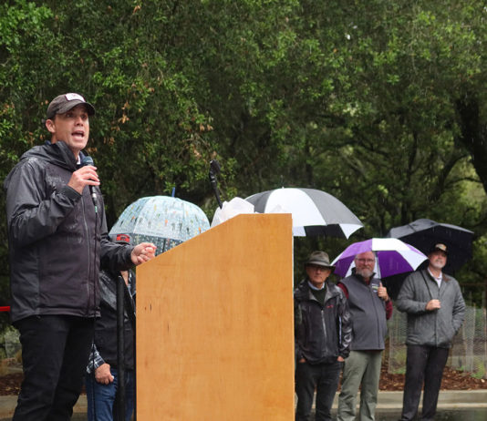 Rain Can’t Dampen Fitch Mountain Celebration Mike McGuire giving speech in the rain