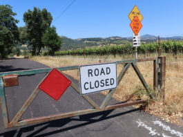 Asti Summer Crossing to Open by July 4 Closed road signs