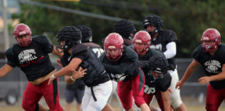 Football action in scrimmage