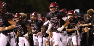 Football team running onto field