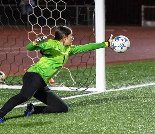 Kimberly Lopez makes a block