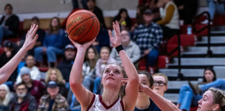 Claire Berry shooting a basket