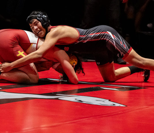 Greyhounds Grapple with Bigger Schools Rodrigo Madrigal grapples with his Cardinal Newman