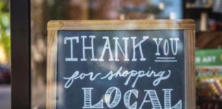 How Healdsburg’s tourism boom is affecting local businesses Chalk sign in a shop window thanking people for shopping locally