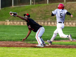 Healdsburg’s Carter Cyphers (5) almost, but not quite, beats the throw to first