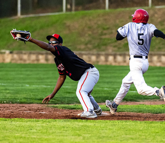 Healdsburg’s Carter Cyphers (5) almost, but not quite, beats the throw to first