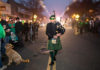 Bagpiper leading pre-dawn parade