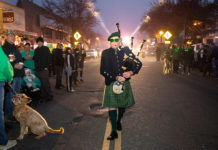 Bagpiper leading pre-dawn parade