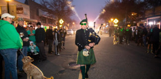 Bagpiper leading pre-dawn parade