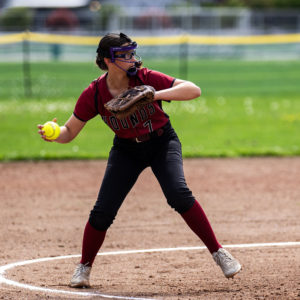 Pitcher Mia Halvorsen  throws to first 