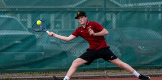 Brandon Hausman playing tennis for Healdsburg