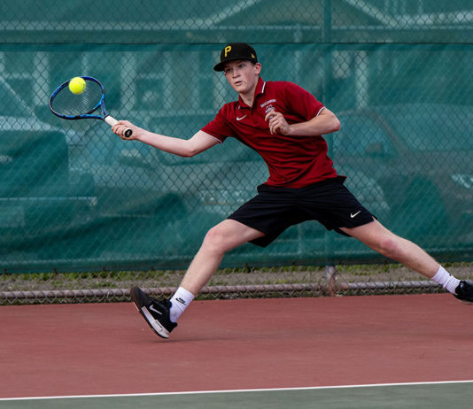 Brandon Hausman playing tennis for Healdsburg