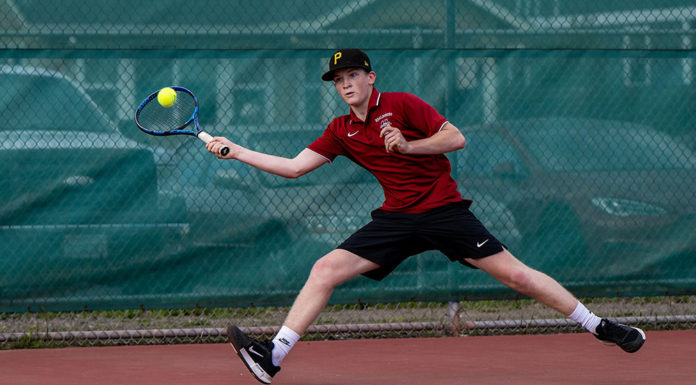 Brandon Hausman playing tennis for Healdsburg