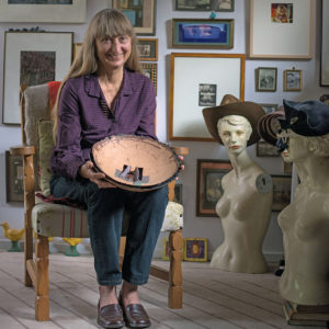 Sylvia Seventy with her artworks