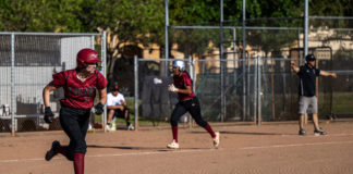 Batter headed for first as runner heads for home