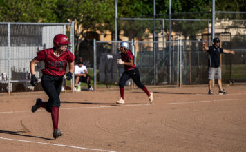 Batter headed for first as runner heads for home