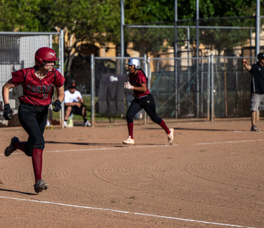 Batter headed for first as runner heads for home