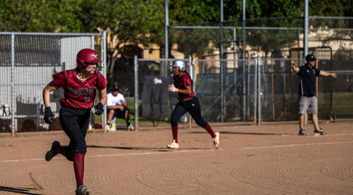 Batter headed for first as runner heads for home