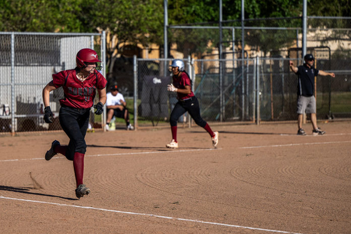 Batter headed for first as runner heads for home