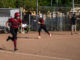 Batter headed for first as runner heads for home