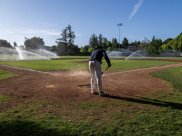 Raking the infield dirt at Rec Park