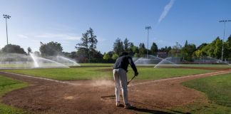 Raking the infield dirt at Rec Park