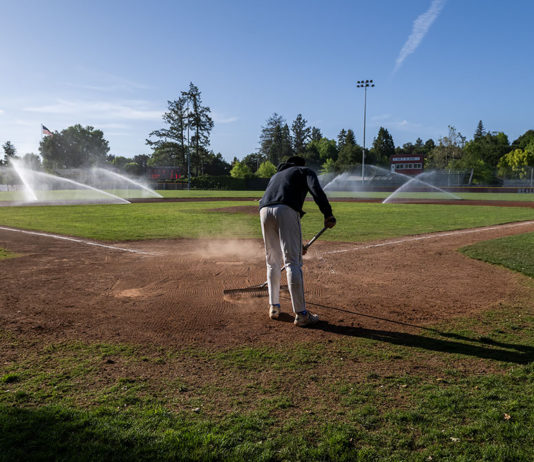 Raking the infield dirt at Rec Park