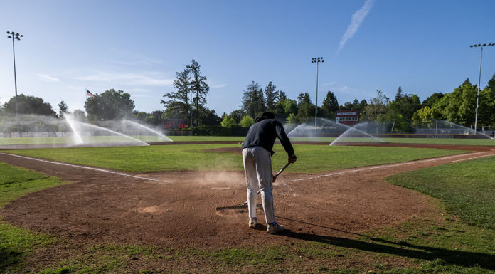 Raking the infield dirt at Rec Park