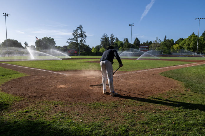 Raking the infield dirt at Rec Park