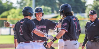 Jacob French scores a run