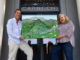 Michael Lightfood presents a painting representing Healdsburg in 1972, as seen from the air.