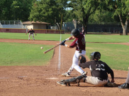SECOND-INNING SLUGGER Jonathan Kim hits the first home run of the year
