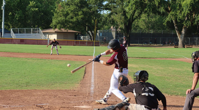SECOND-INNING SLUGGER Jonathan Kim hits the first home run of the year