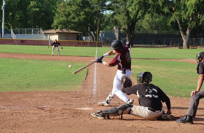SECOND-INNING SLUGGER Jonathan Kim hits the first home run of the year