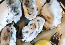 Oysters on a plate with lemon