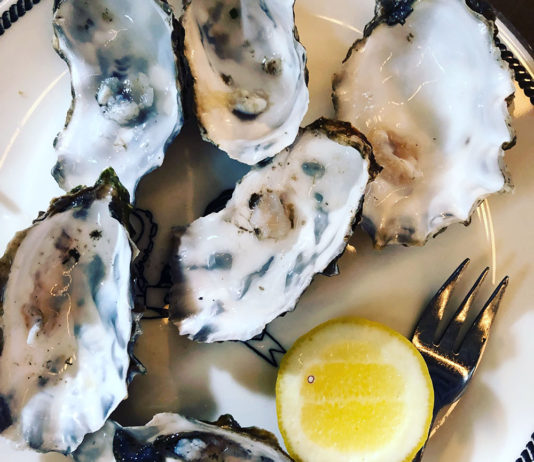 Oysters on a plate with lemon