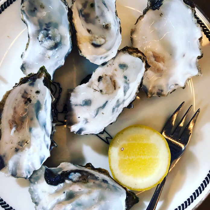 Oysters on a plate with lemon