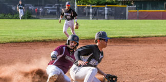 Baserunner Logan Sutter slides into third
