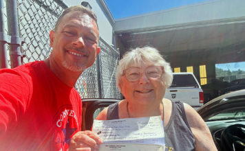 Boosters hand over the checks