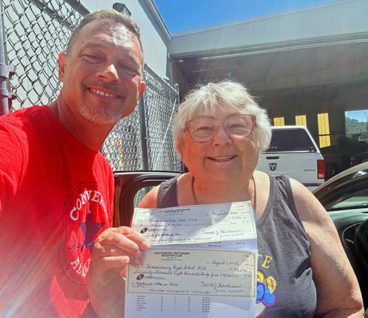 Boosters hand over the checks