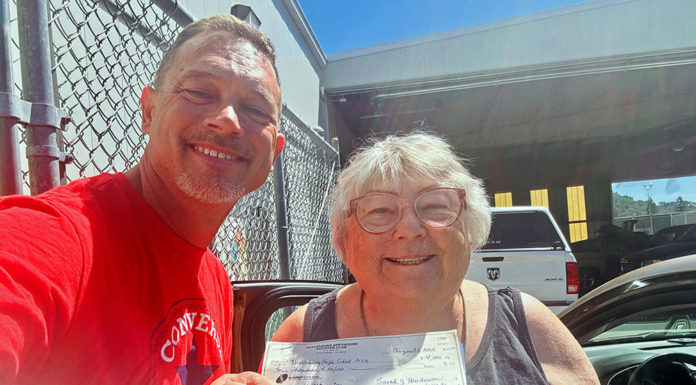 Boosters hand over the checks