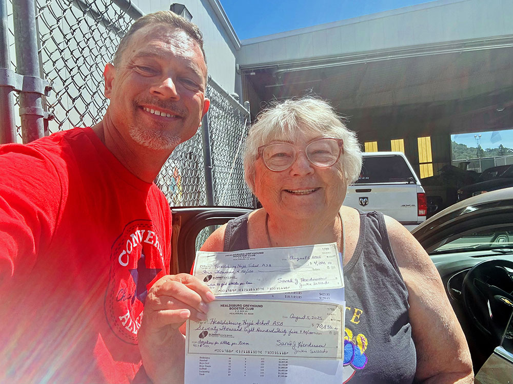 Boosters hand over the checks