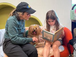 Reading to a dog at Healdsburg Library